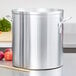 A large silver Vollrath Wear-Ever aluminum stock pot on a counter.