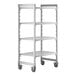 A white plastic Cambro Camshelving Premium mobile shelving unit with 4 shelves and wheels.