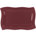 A maroon rectangular cast aluminum platter with wavy edges.