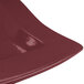 A maroon rectangular Tablecraft metal platter with a white speckled line on the edge.