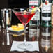 A customizable martini in an Arcoroc Excalibur martini glass with a lemon garnish.