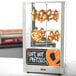 A Nemco countertop pretzel warmer displaying pretzels.