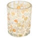 A Sterno light gold glass votive candle holder with a mosaic pattern.