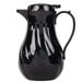A black thermal coffee carafe with a handle.
