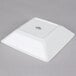 A white square Tuxton China bowl.