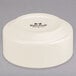 A white Tuxton stackable china bowl with black text on it.