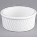 A Tuxton white china ramekin with a ribbed rim.