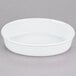 A white oval porcelain serving platter.