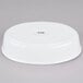 A white oval porcelain serving platter.