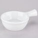 A white Tuxton French casserole dish with a handle.