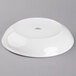 A Tuxton white porcelain pasta bowl with a gray surface.