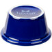 A cobalt blue Tuxton china ramekin with white text on the side.