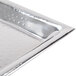 A close up of a silver American Metalcraft stainless steel tray with a hammered finish.