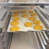 The  Full Size Aluminum Bun Pan in action.  I have my pans lined with parchment paper as they are holding my cookies out of the way as they are drying.  Wonderful baking pans!
