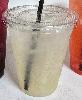12 oz. cup with lid used for lemonade, also featuring choice unwrapped black straw