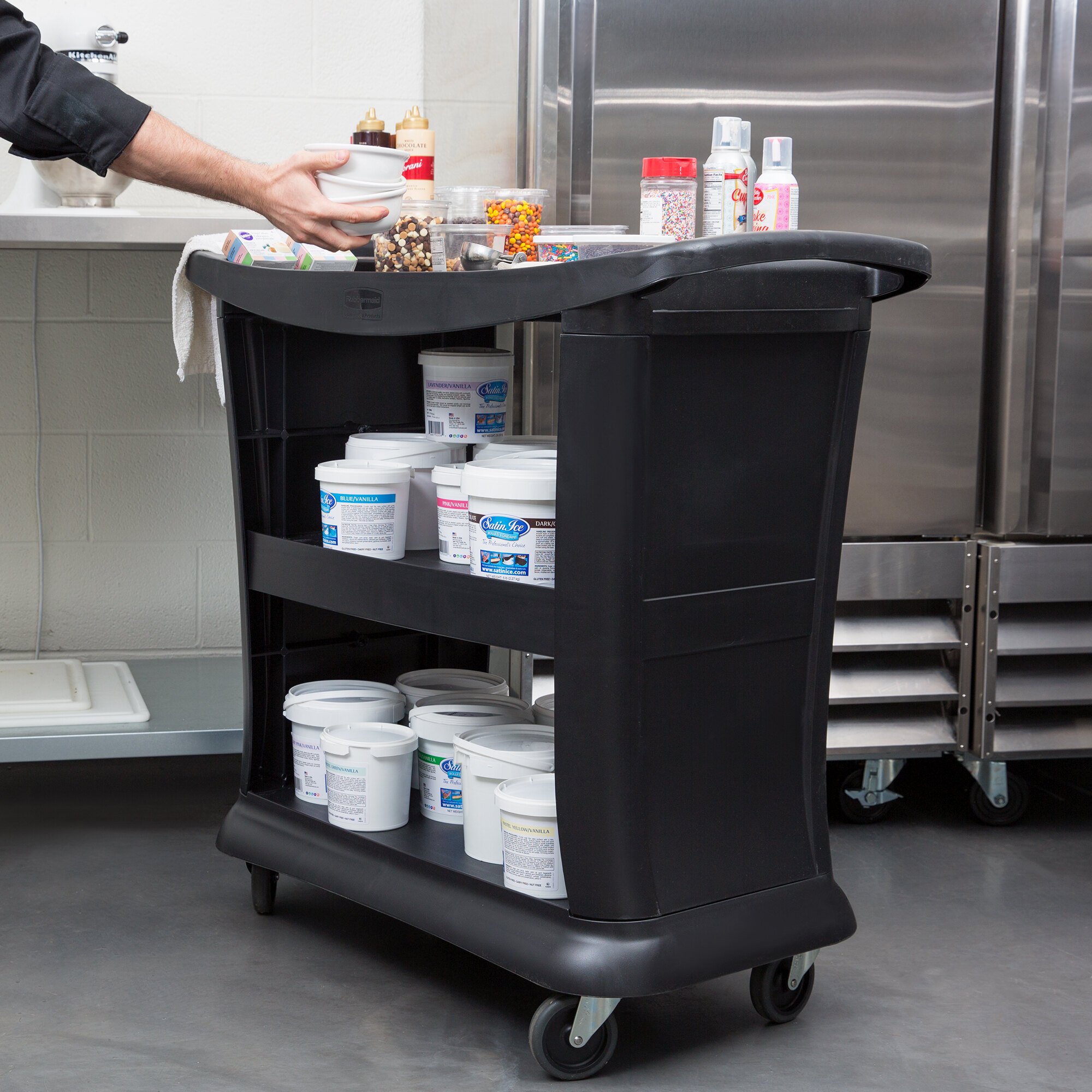 Rubbermaid FG9T6800BLA Black Executive Three Shelf Bussing Cart