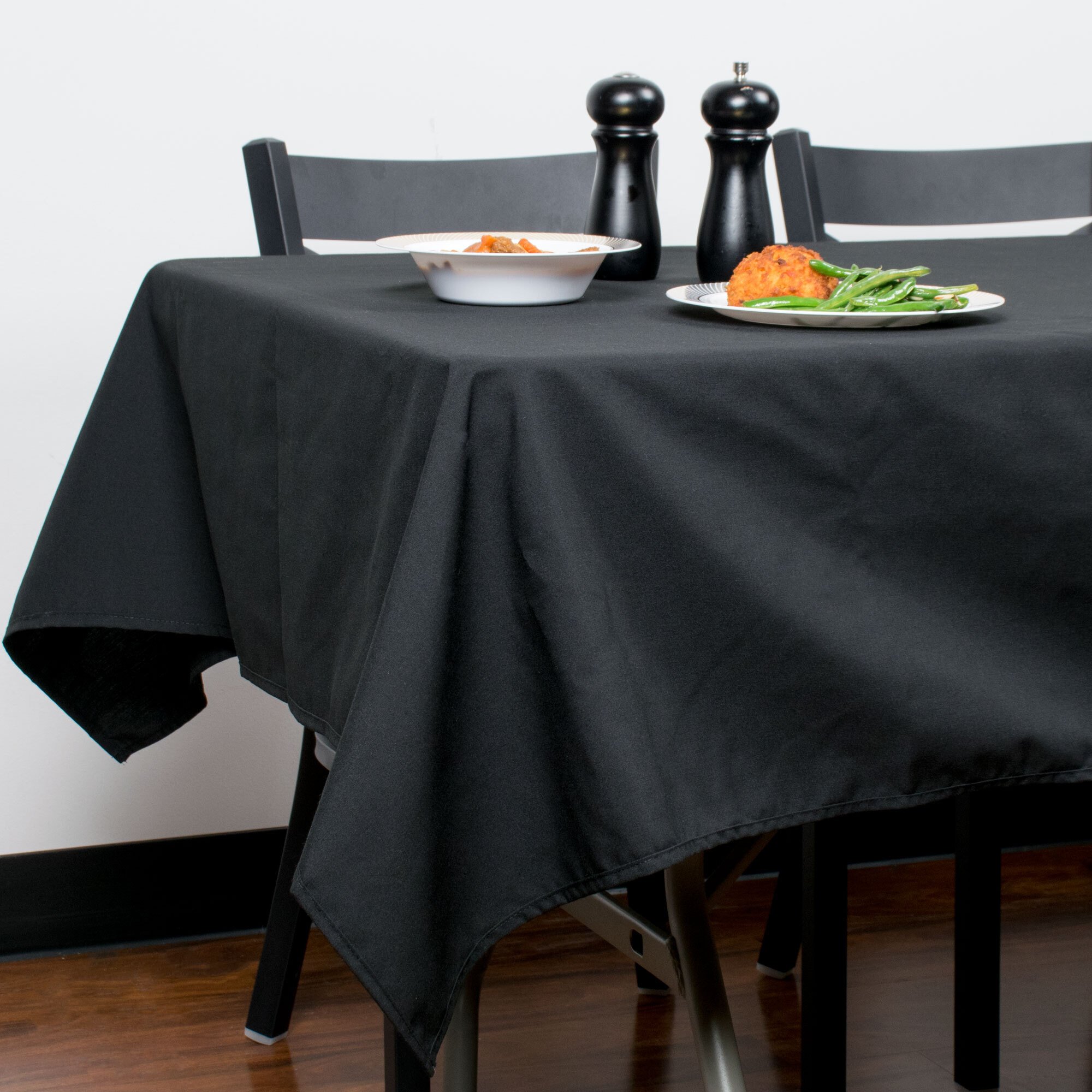 Intedge 54" x 120" Rectangular Black Hemmed Polyspun Cloth Table Cover