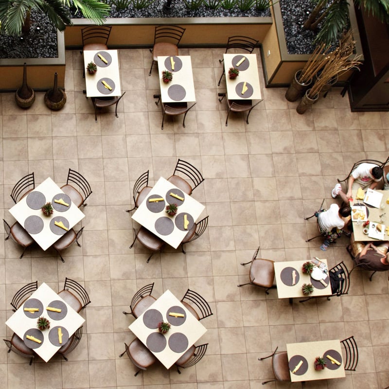 organized restaurant dining room with tables and chairs set up for opening day