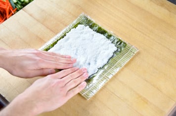 rolling uramaki with rice