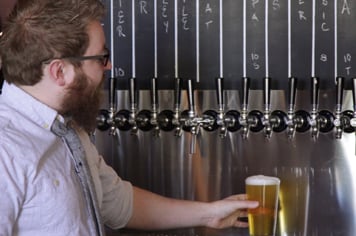 bartender serving draft beer