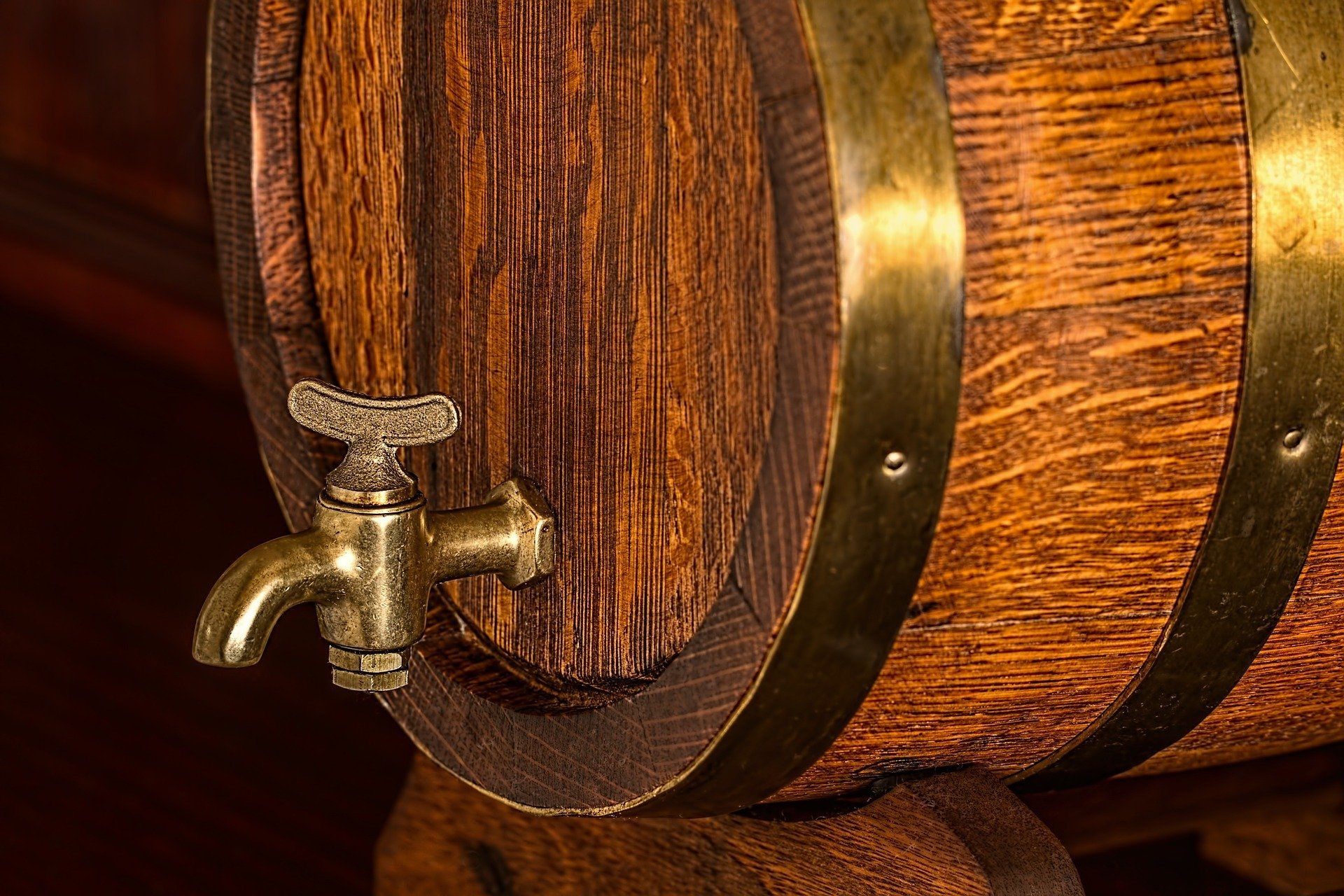  A wooden barrel with a brass spigot on the side with the words 'Sinai Sour' written on the barrel.