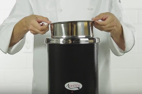 chef removing inset from soup warmer