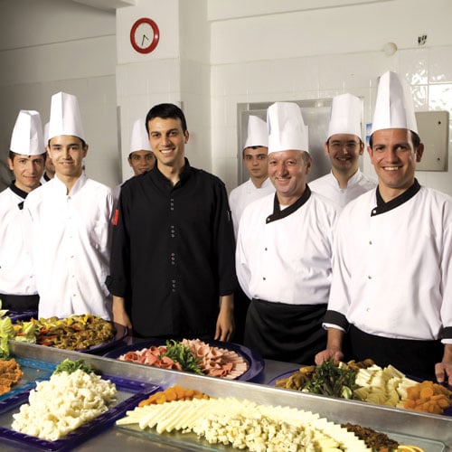 Restaurant owner and kitchen staff