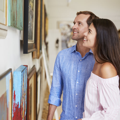 Couple at a First Friday gallery exhibition