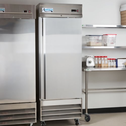Two commercial reach-in refrigerators in a kitchen