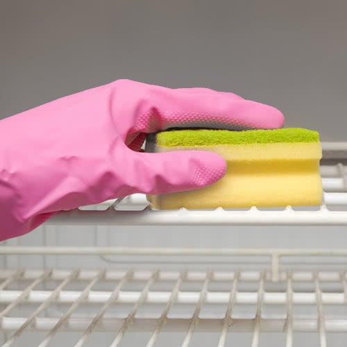 cleaning a commercial fridge