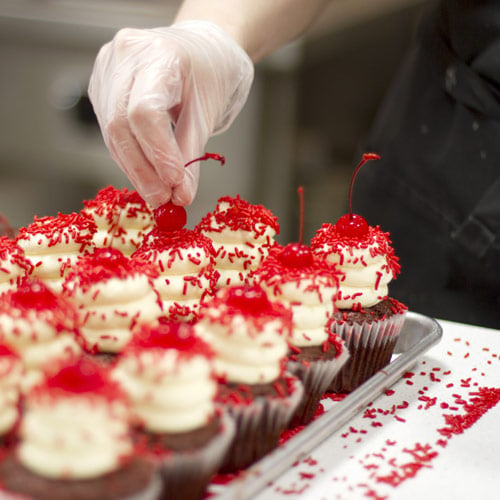 decorating cupcakes in a home bakery