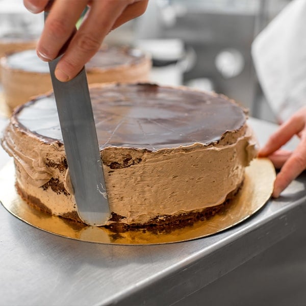 Cake Baker Frosting a Cake