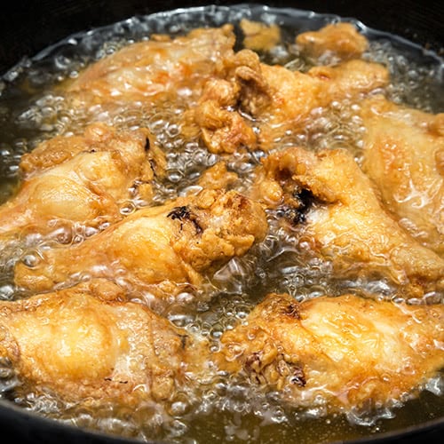 frying chicken wings in hot oil