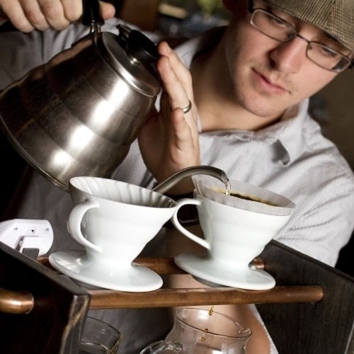 barista making drip coffee