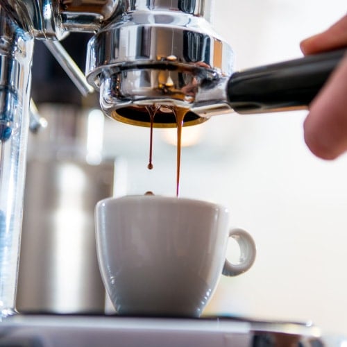 Barista making fresh espresso