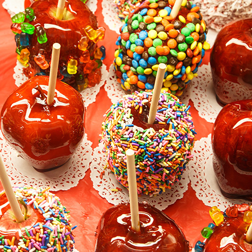 candy apples with different candy apple toppings