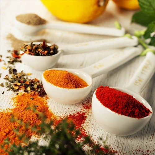 Herbs and spices in measuring spoons 