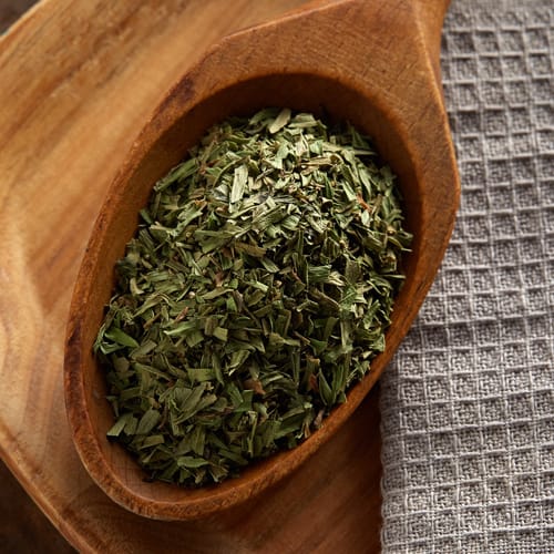 Tarragon ingredient in a wooden spoon