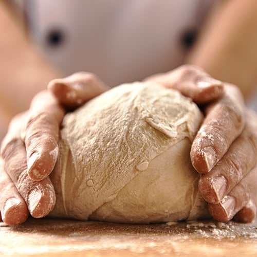 kneading bread dough