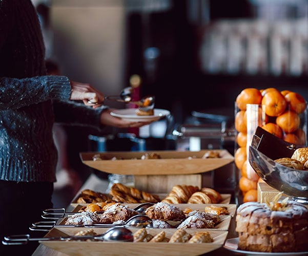 Juicing Woman choosing Continental Breakfast Options