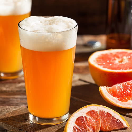 Golden-hued beer with a frothy head in a beer glass