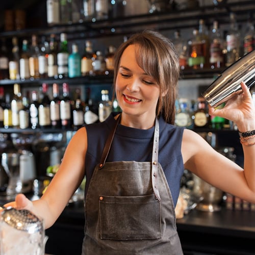 a bartender demonstrating how to prepare a drink