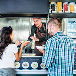 Food Truck owner serving customers