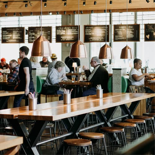 long wooden table in food hall