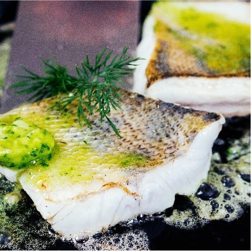 Cooked fish with compound butter