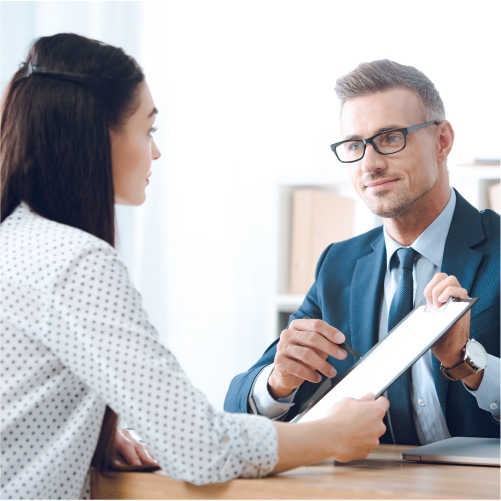 Woman at speaking with insurance agent at table