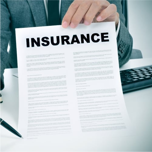 Person holding insurance paperwork