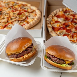 Hamburgers and Pizzas in To Go Boxes