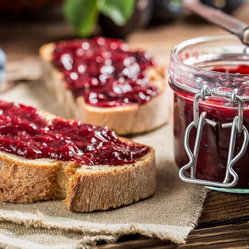 Closeup of sandwich with fresh plum jam