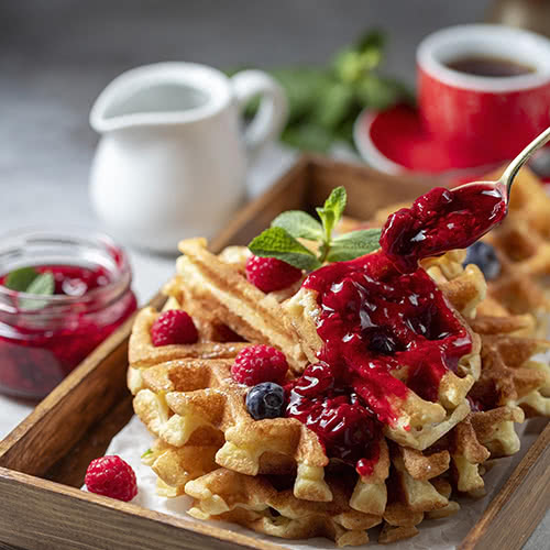 Homemade sourdough waffles with berry preserves